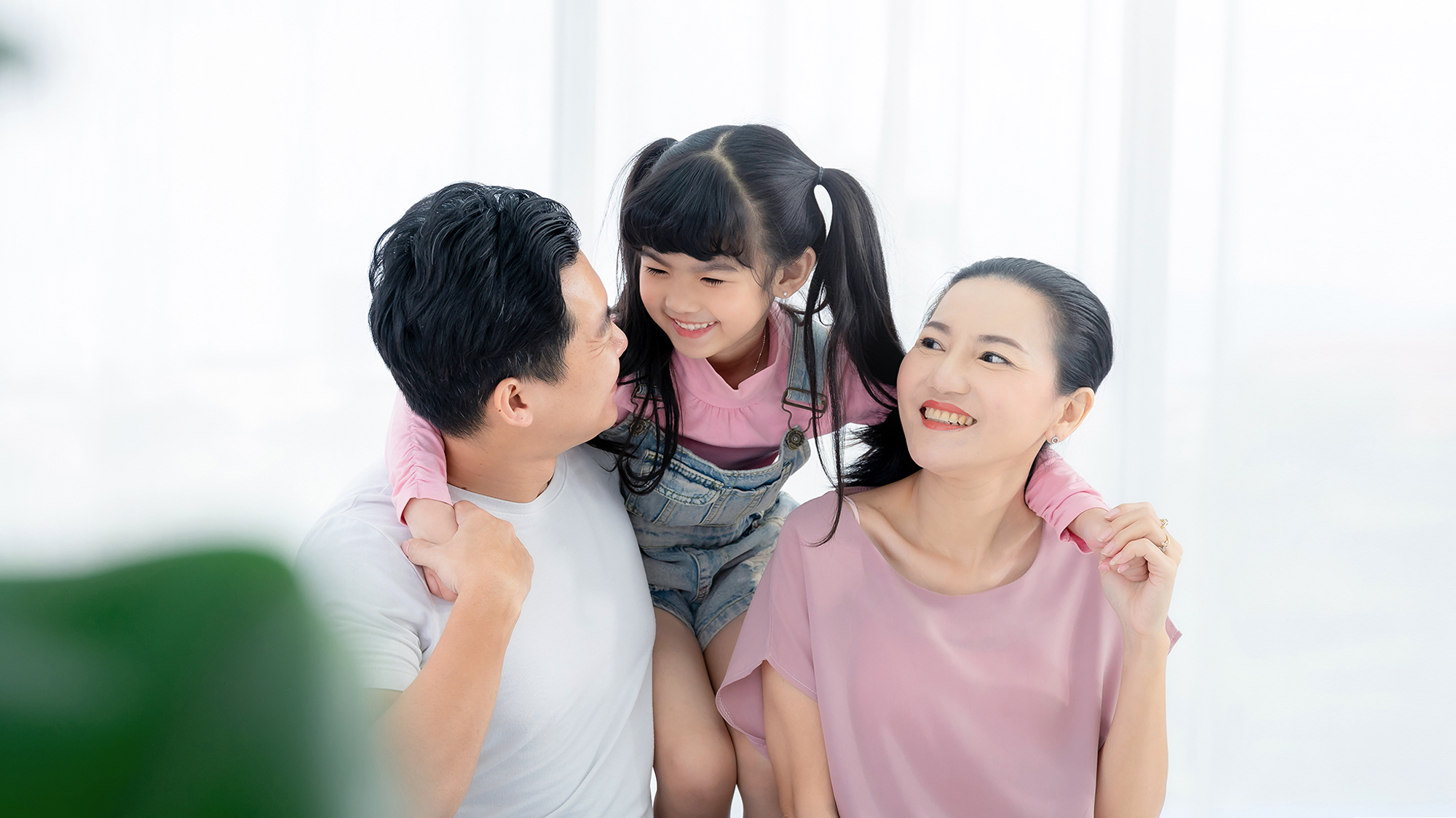 Asian family enjoy their free time relax together at home. 